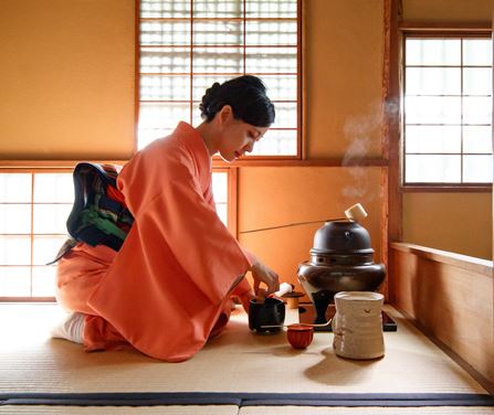 the host performing the tea ceremony